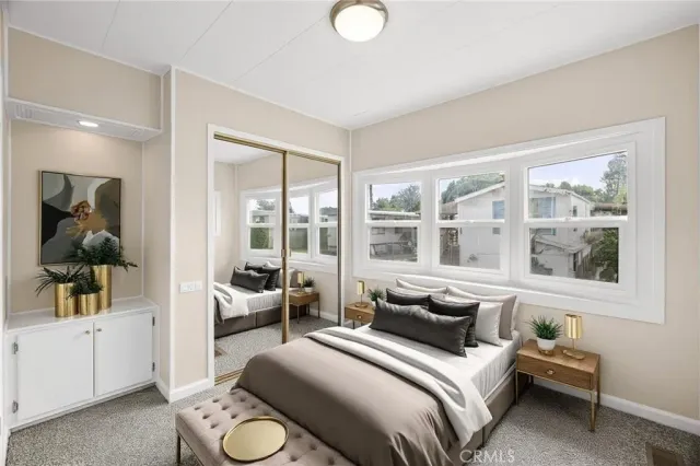 a bedroom with bed and a window