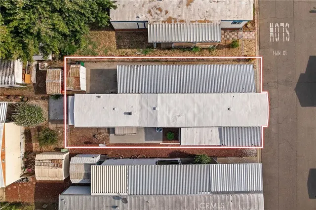 a view of a backyard with sitting area
