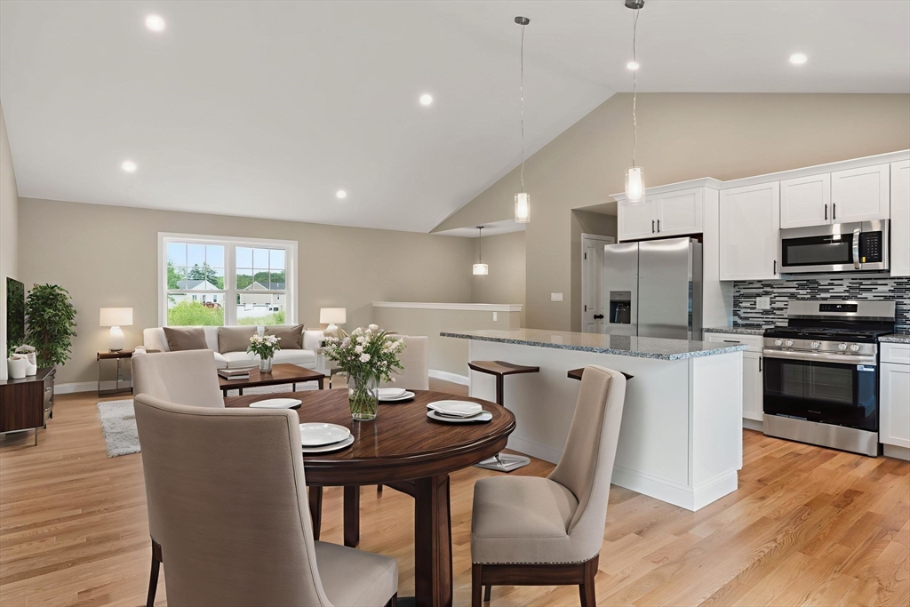 16 Bronson Street Fall River, MA 02721 - Photo 11 of 21 a view of a dining room with furniture window and wooden floor