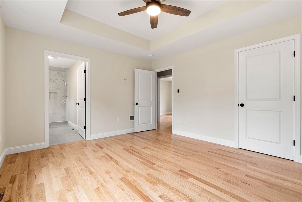16 Bronson Street Fall River, MA 02721 - Photo 14 of 21 a view of a room with a ceiling fan and hardwood floor
