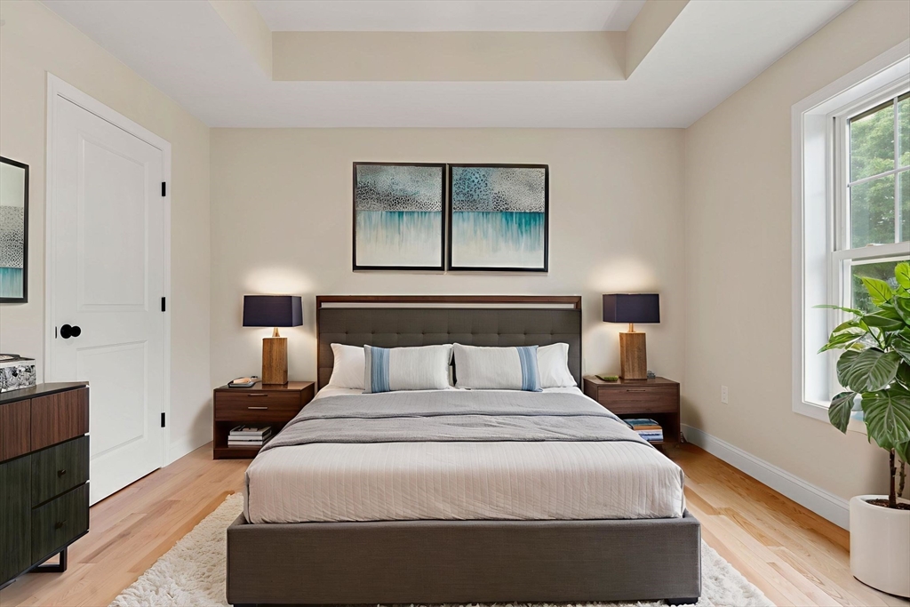 16 Bronson Street Fall River, MA 02721 - Photo 15 of 21 a bedroom with a bed and wooden floor