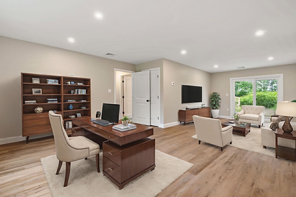 16 Bronson Street Fall River, MA 02721 - Photo 8 of 21 a living room with furniture and a flat screen tv