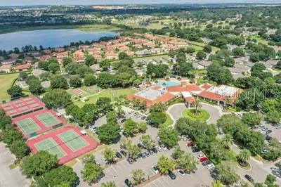 an aerial view of residential house with outdoor space and lake view