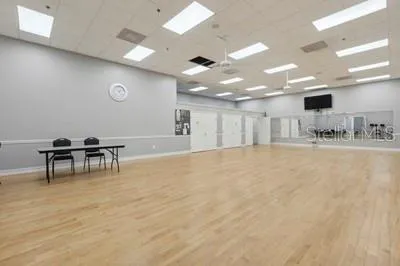 a large room with gym equipment