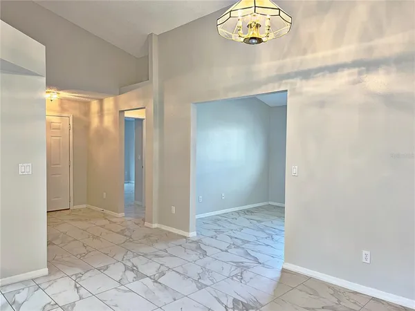 en empty room with window and mirror