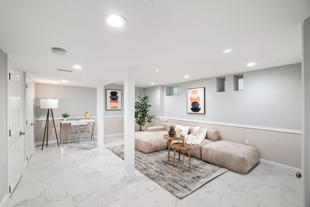 a living room with furniture and a table
