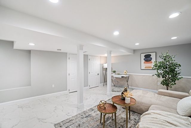 a living room with furniture and a table