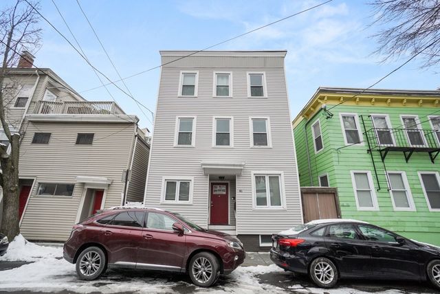 a car parked in front of a house