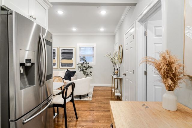 a view of a kitchen and dining room