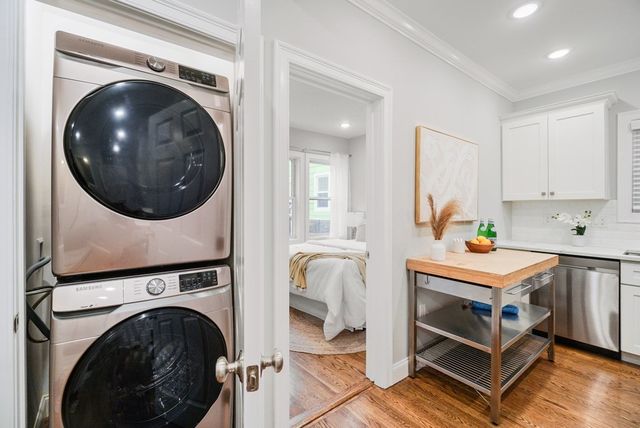 a view of livingroom with washer and dryer