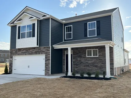 a front view of a house with a garage