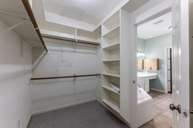 a view of an empty walk in closet