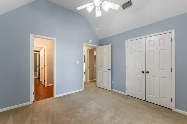 a view of a livingroom with a chandelier fan