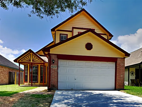 a front view of a house with yard