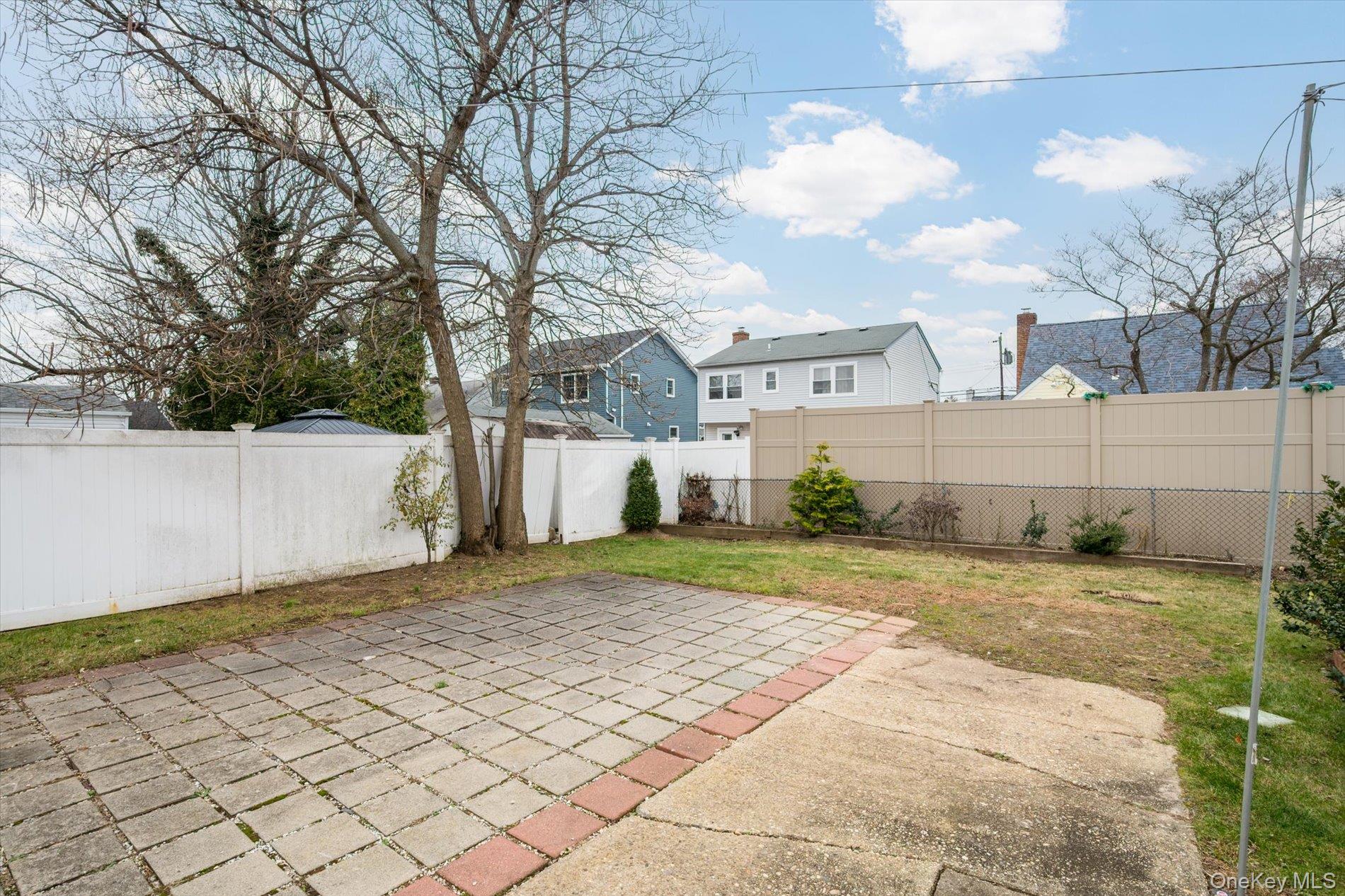 20 Kenneth Avenue Bellmore, NY 11710 - Photo 18 of 24 a view of a backyard of the house