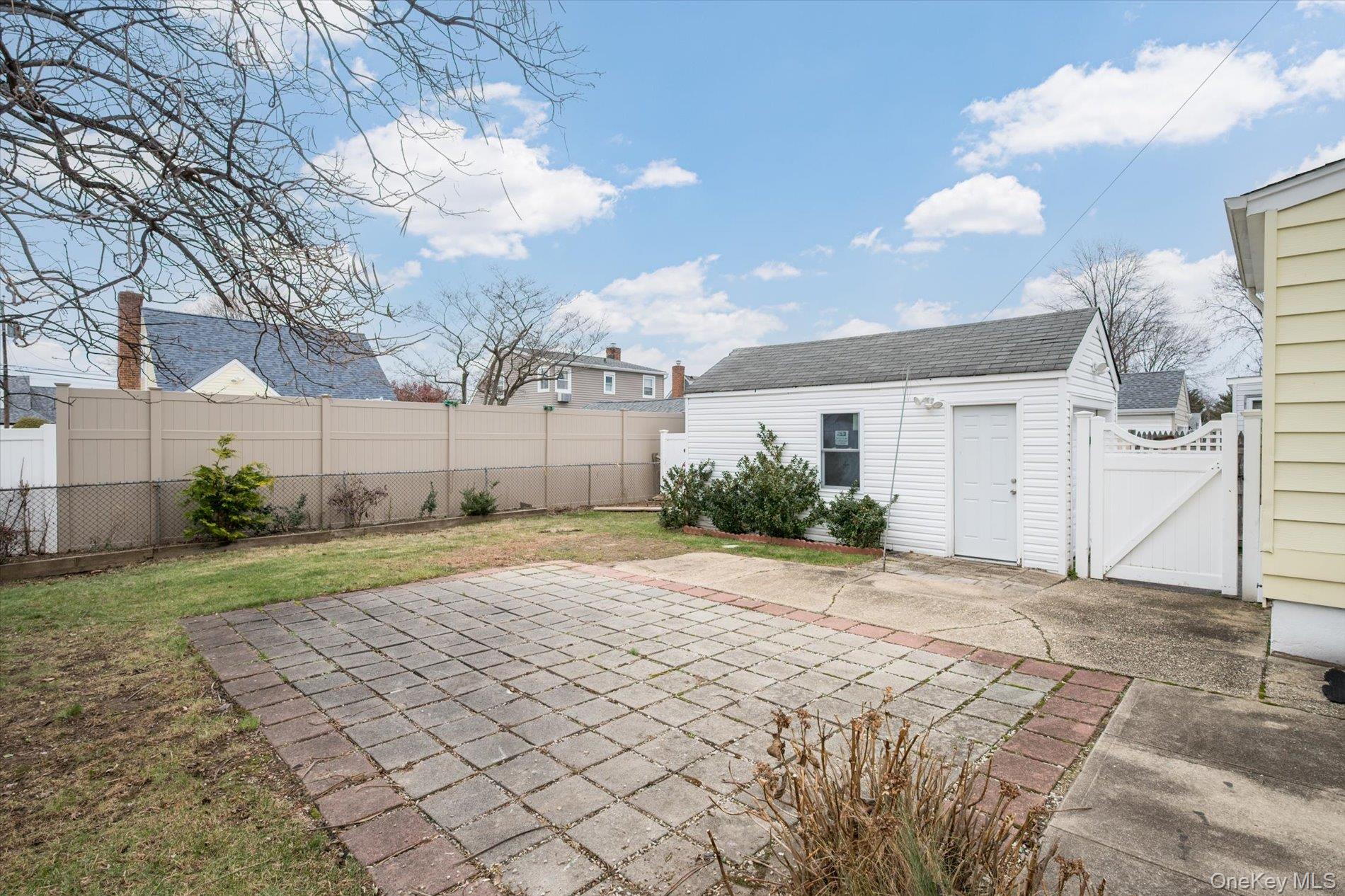 20 Kenneth Avenue Bellmore, NY 11710 - Photo 19 of 24 a view of a house with a yard