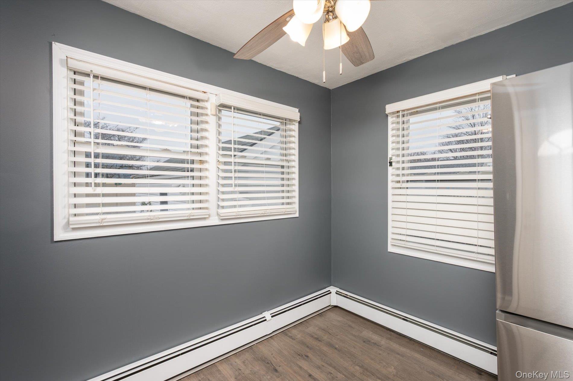 20 Kenneth Avenue Bellmore, NY 11710 - Photo 5 of 24 a view of an empty room with wooden floor and a window