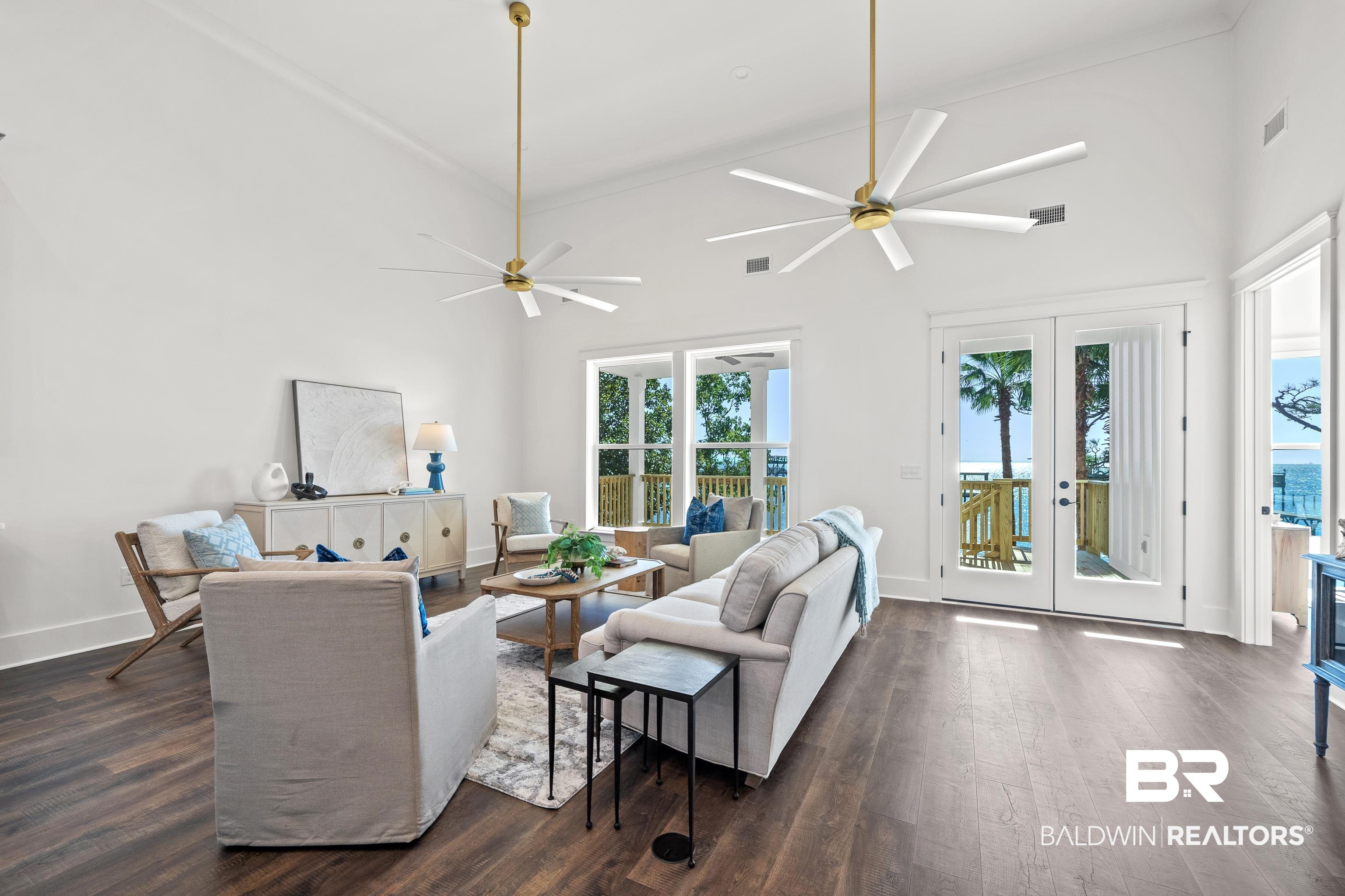 12453 County Road 1 Fairhope, AL 36532 - Photo 10 of 33 Living room with ceiling fan, dark hardwood / wood-style flooring, high vaulted ceiling, and french doors