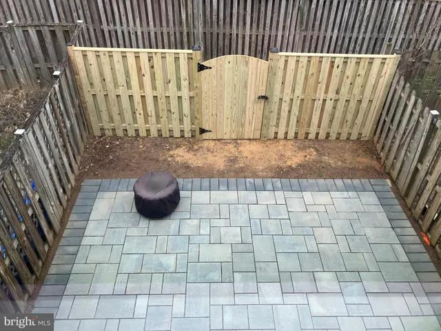 a view of outdoor space with wooden fence