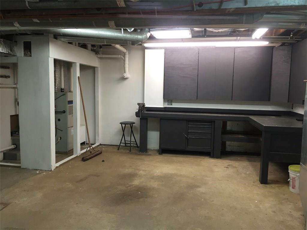 685 Pluto Road Ligonier, PA 15658 - Photo 19 of 25 Garage workbench and cabinets above