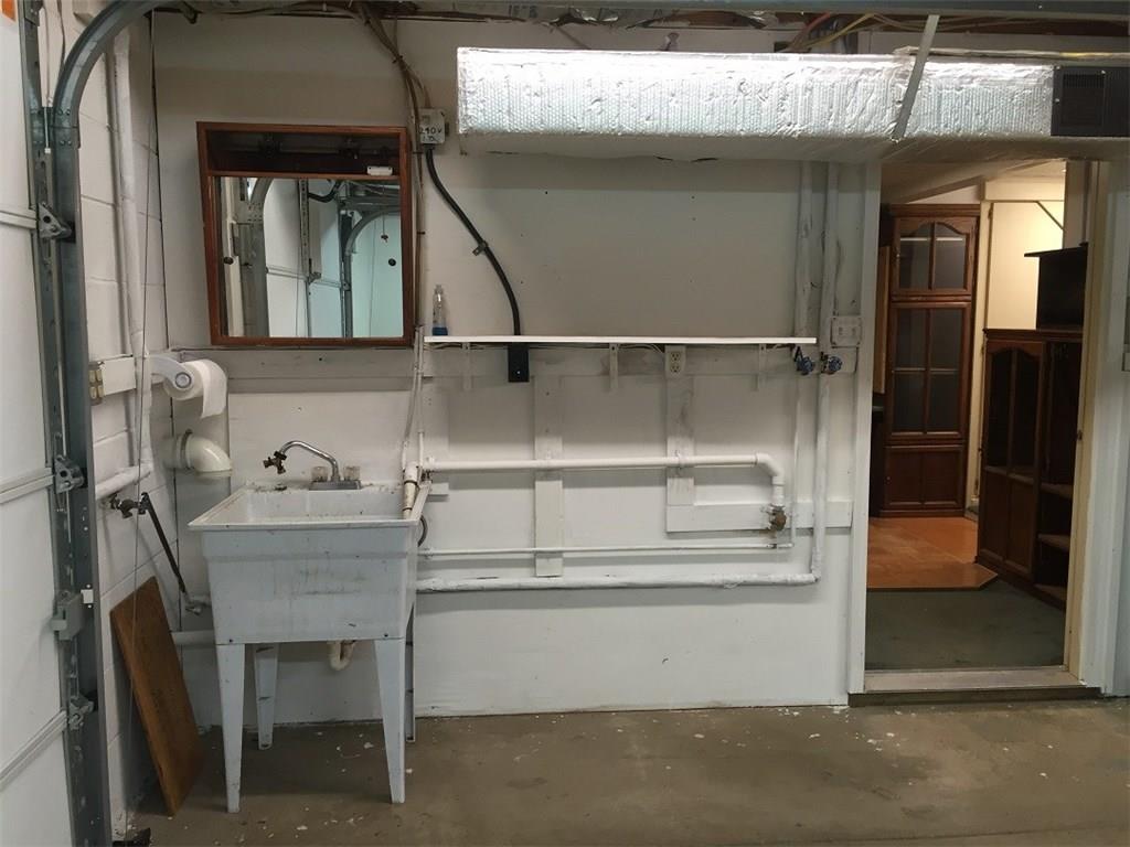 685 Pluto Road Ligonier, PA 15658 - Photo 20 of 25 Laundry tub and appliance hook ups for washer and dryer in the garage...door to the office