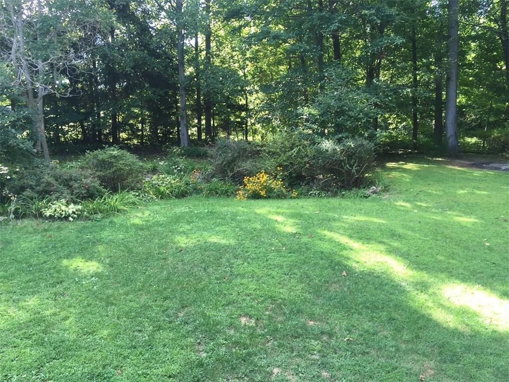 685 Pluto Road Ligonier, PA 15658 - Photo 21 of 25 Level back yard with perennial garden...woods beyond and to the right