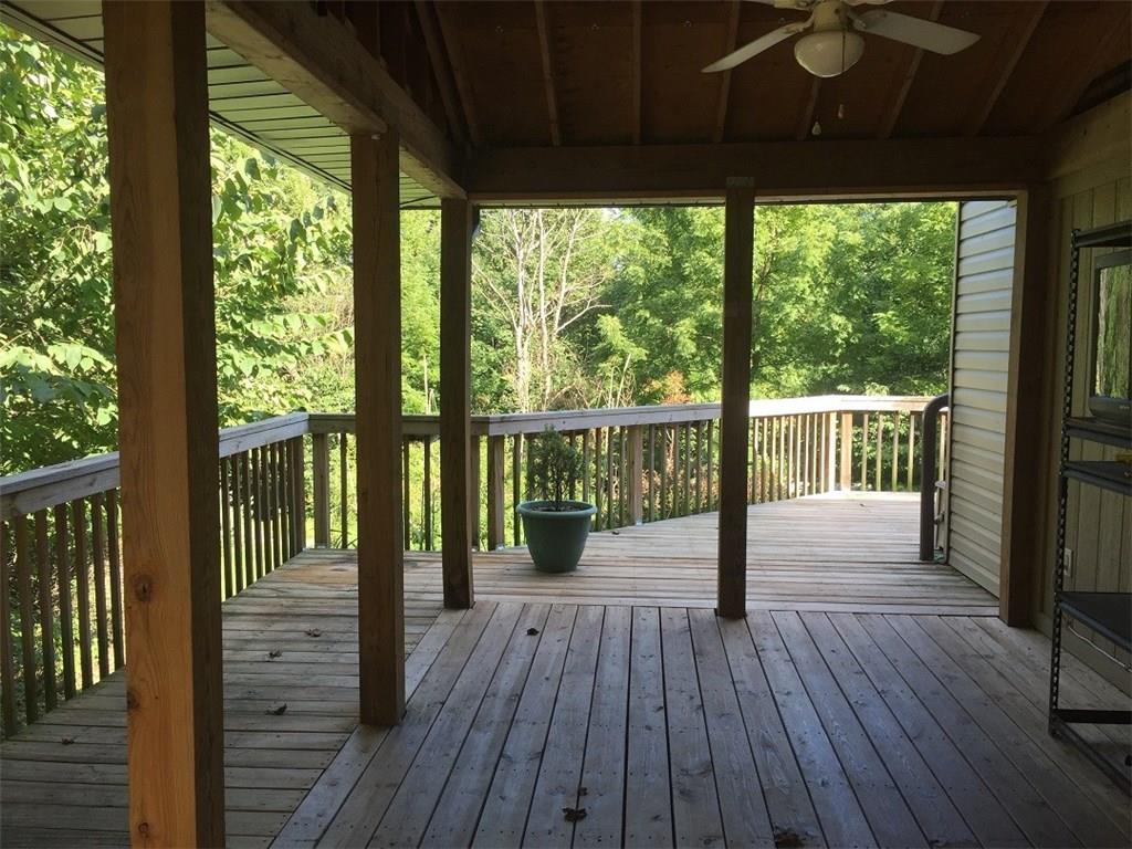 685 Pluto Road Ligonier, PA 15658 - Photo 23 of 25 Side deck which continues around the front of the house.
