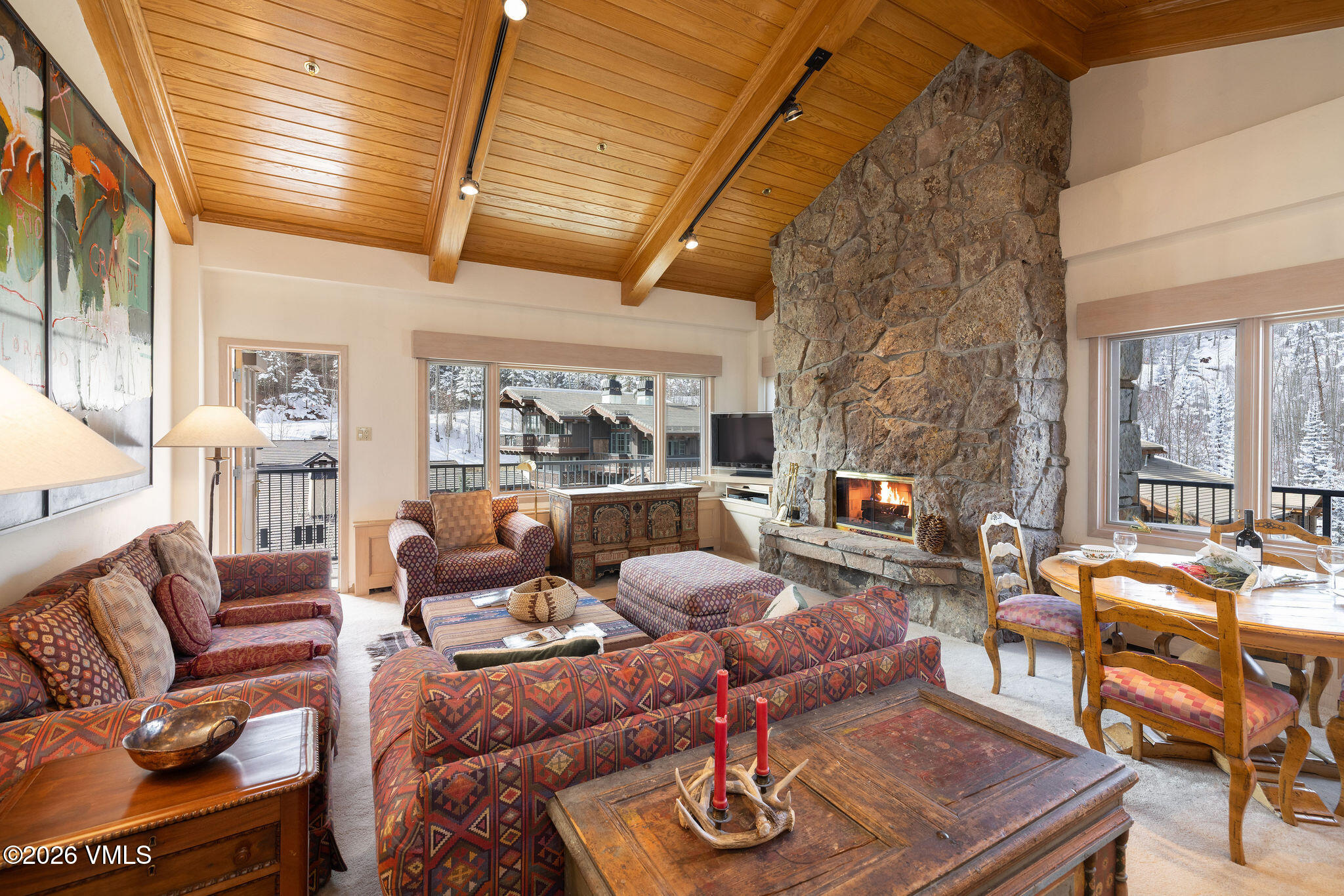 200 Vail Road, Unit 799 Vail, CO 81657 - Photo 2 of 32 a living room with furniture and a large window