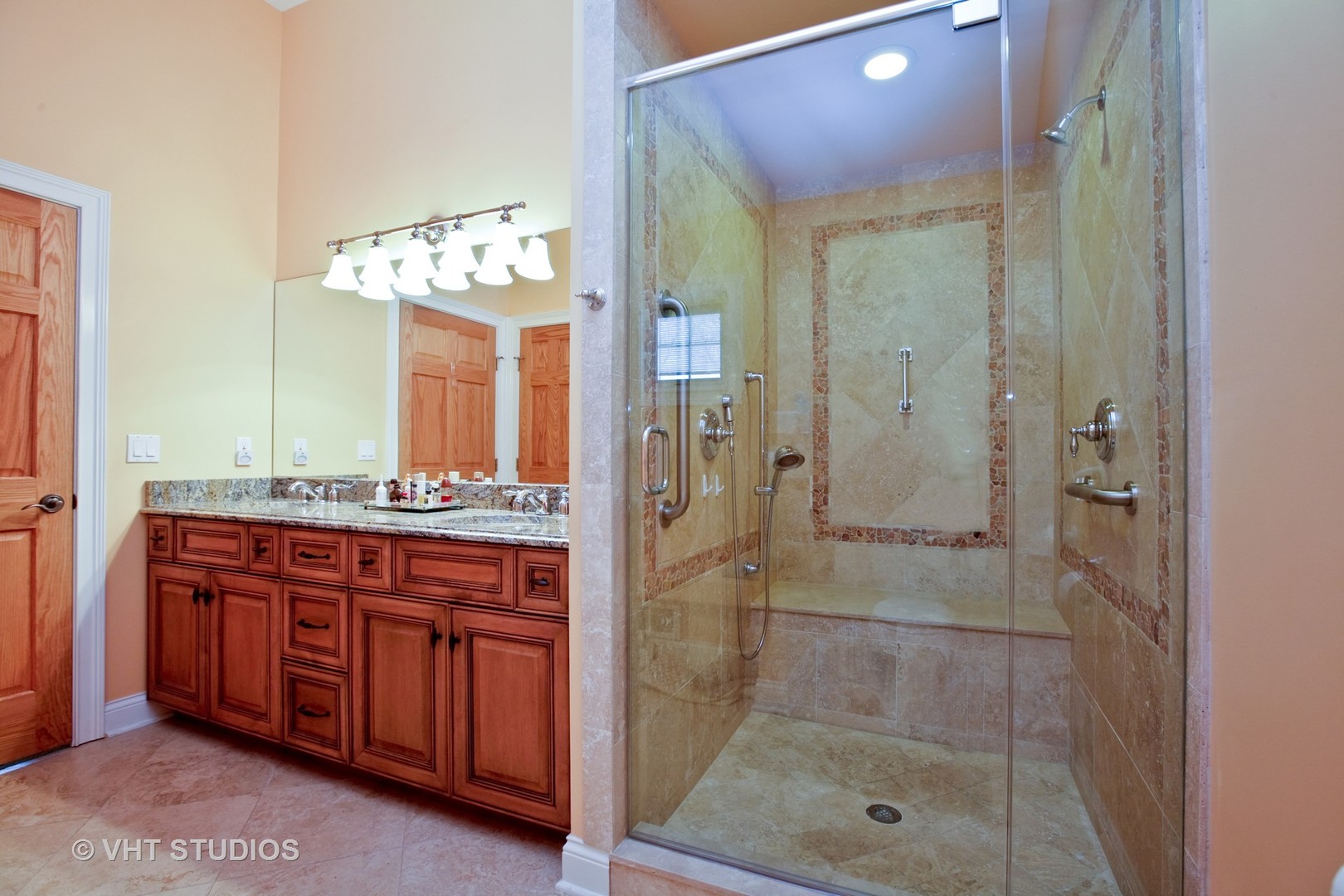 231 South Lincoln Street Westmont, IL 60559 - Photo 7 of 9 a bathroom with a shower sink and mirror