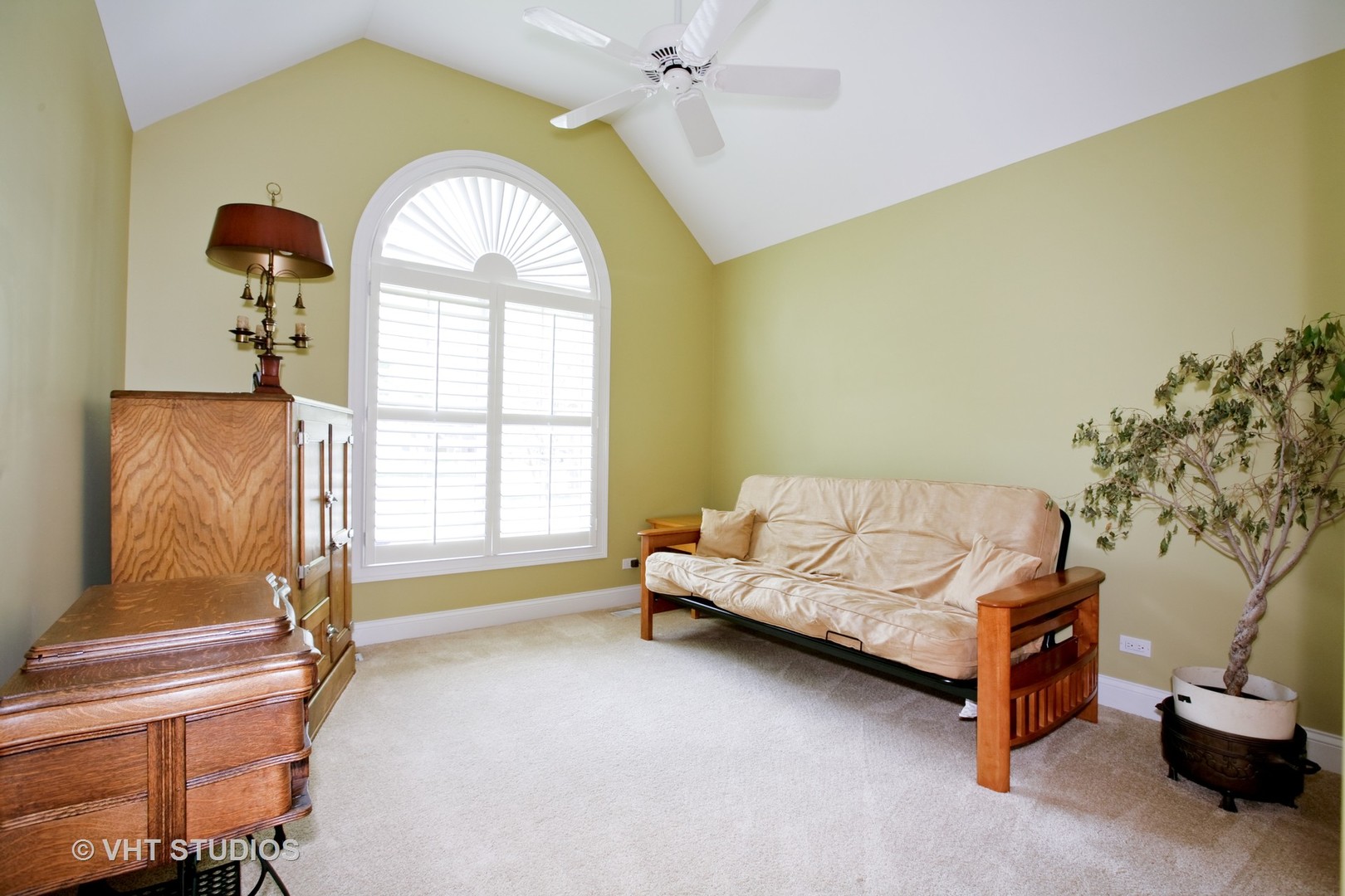 231 South Lincoln Street Westmont, IL 60559 - Photo 8 of 9 a bedroom with a bed and a window