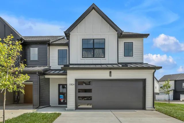 a front view of a house with a garage