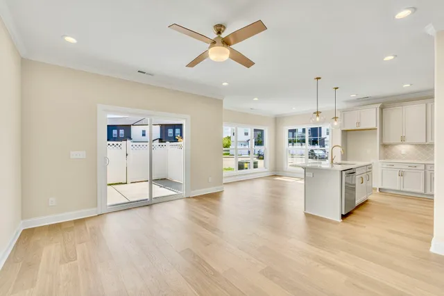 a view of kitchen with cabinets and wooden floor