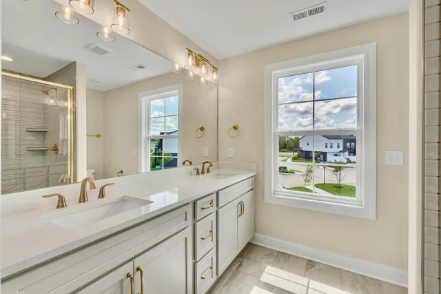 a bathroom with a sink and a large mirror