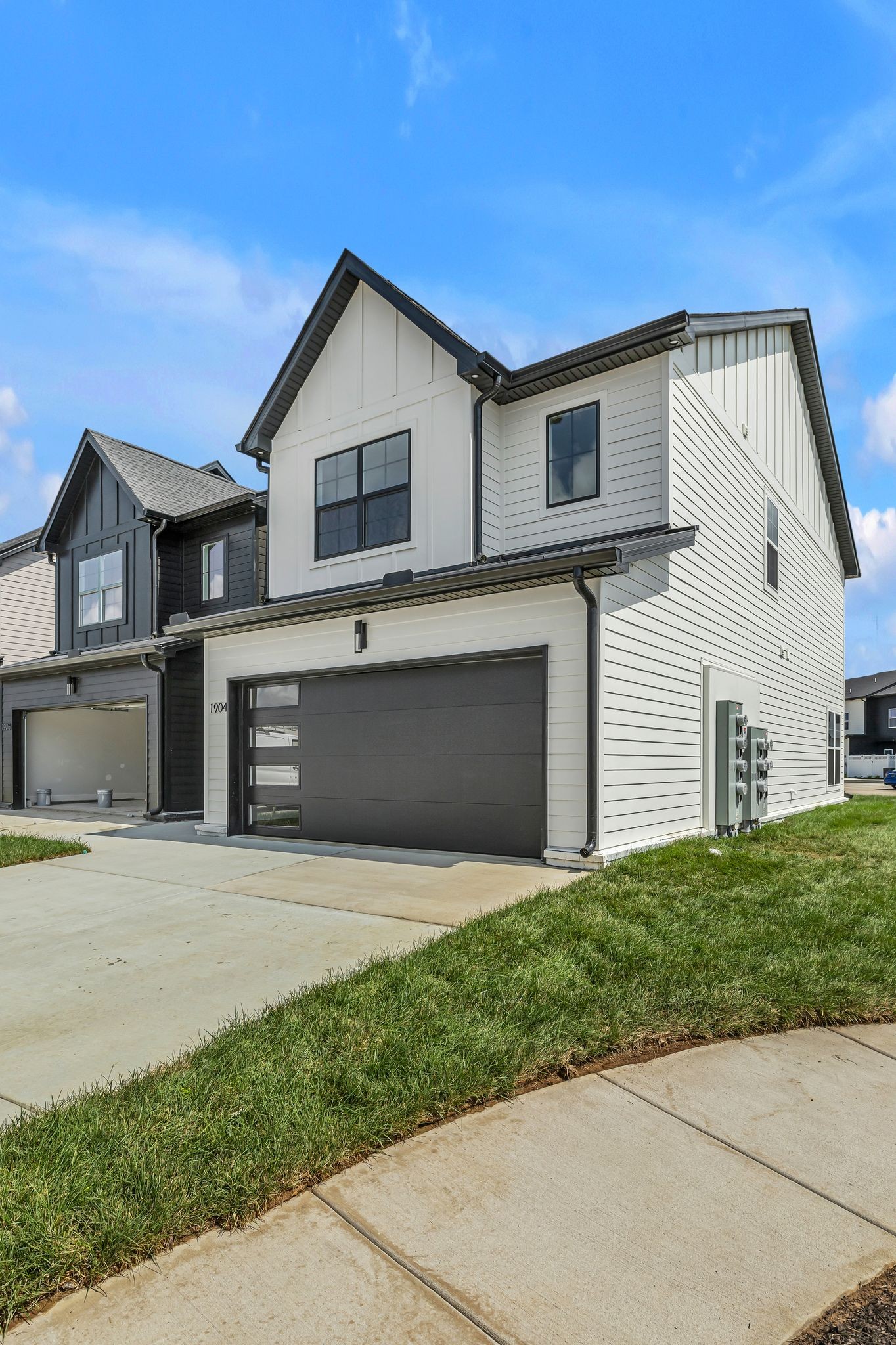 1905 Gracie Bug Loop Murfreesboro, TN 37128 - Photo 9 of 31 a front view of a house with a yard and garage
