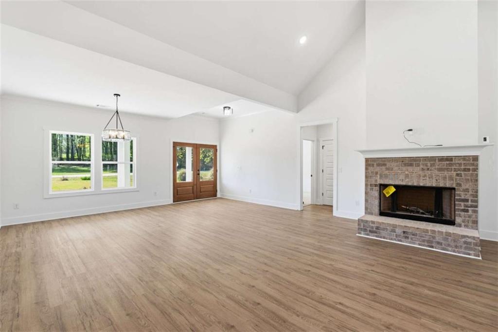 11691 Hazelbrand Road Northeast Covington, GA 30014 - Photo 8 of 53 a view of an empty room with window and fire place