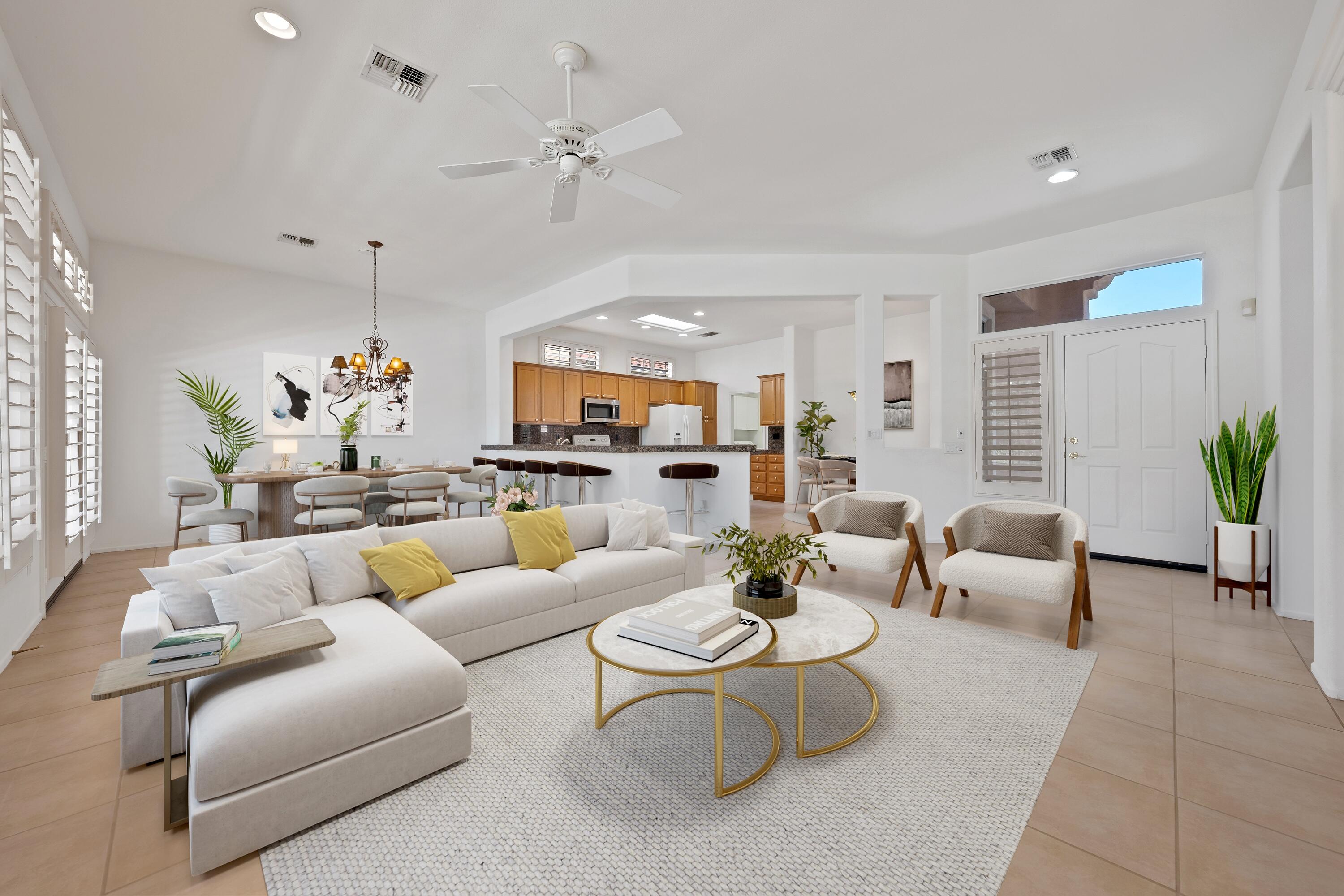 78513 Sunrise Mountain View Palm Desert, CA 92211 - Photo 13 of 45 a living room with furniture and a chandelier