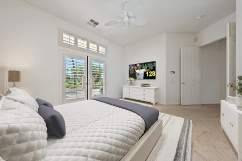 a spacious bathroom with a granite countertop sink mirror and bathtub