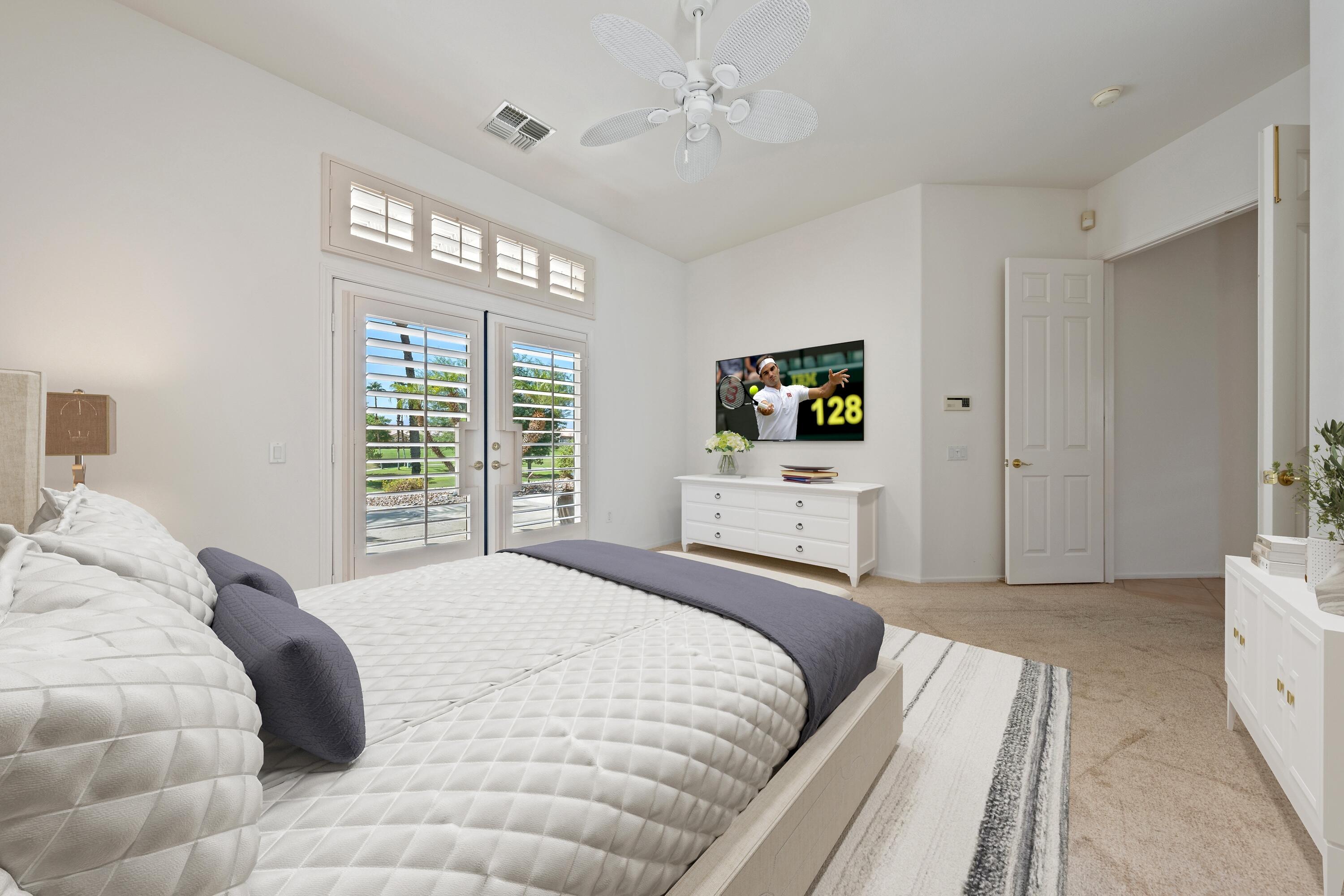 78513 Sunrise Mountain View Palm Desert, CA 92211 - Photo 29 of 45 a bedroom with a large bed and a window