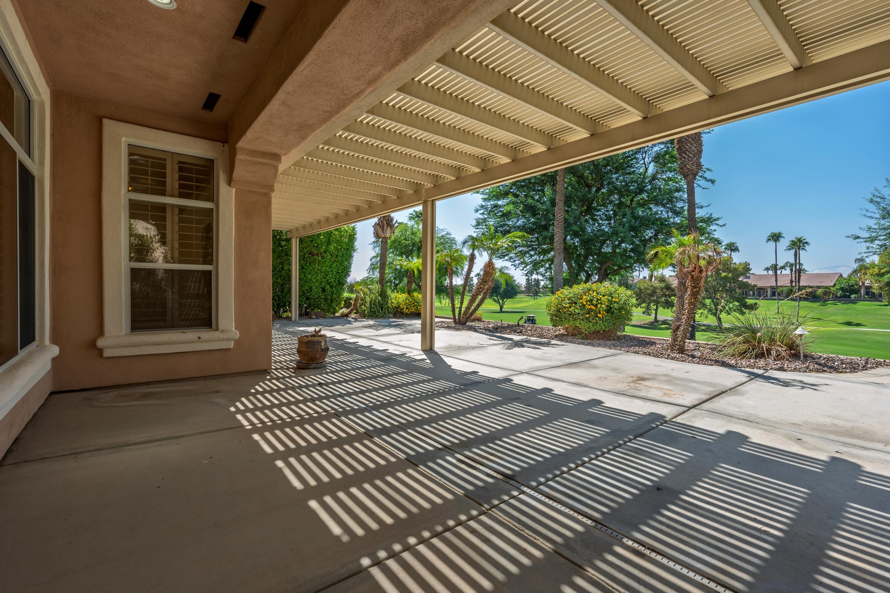 78513 Sunrise Mountain View Palm Desert, CA 92211 - Photo 3 of 45 a view of a backyard with sitting area