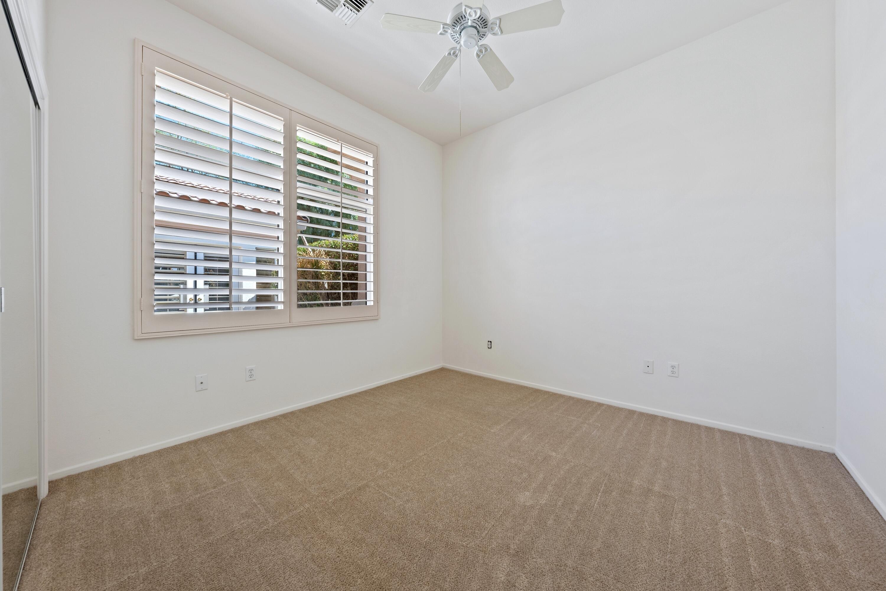 78513 Sunrise Mountain View Palm Desert, CA 92211 - Photo 32 of 45 an empty room with a window