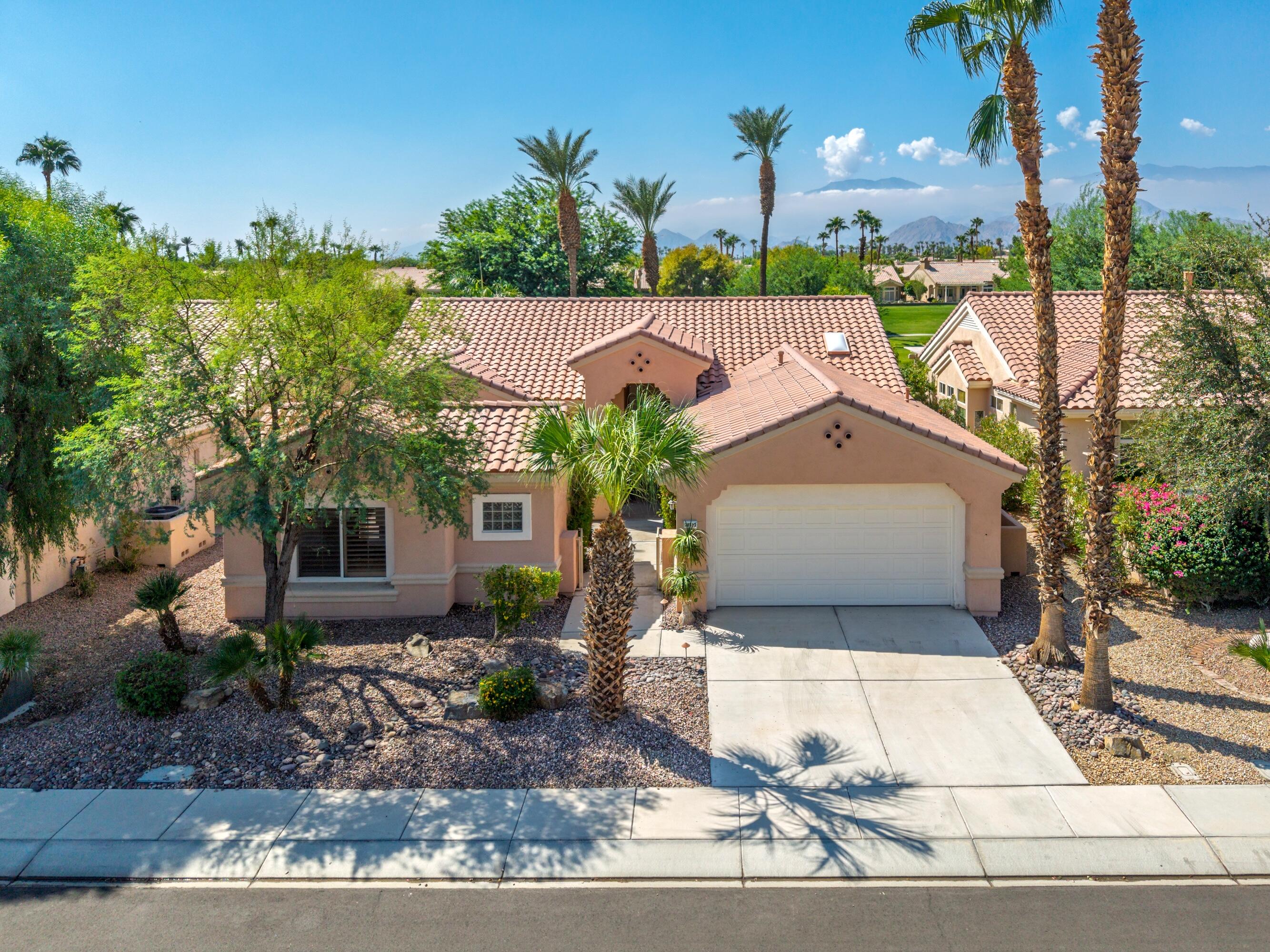 78513 Sunrise Mountain View Palm Desert, CA 92211 - Photo 41 of 45 a front view of a house with garden