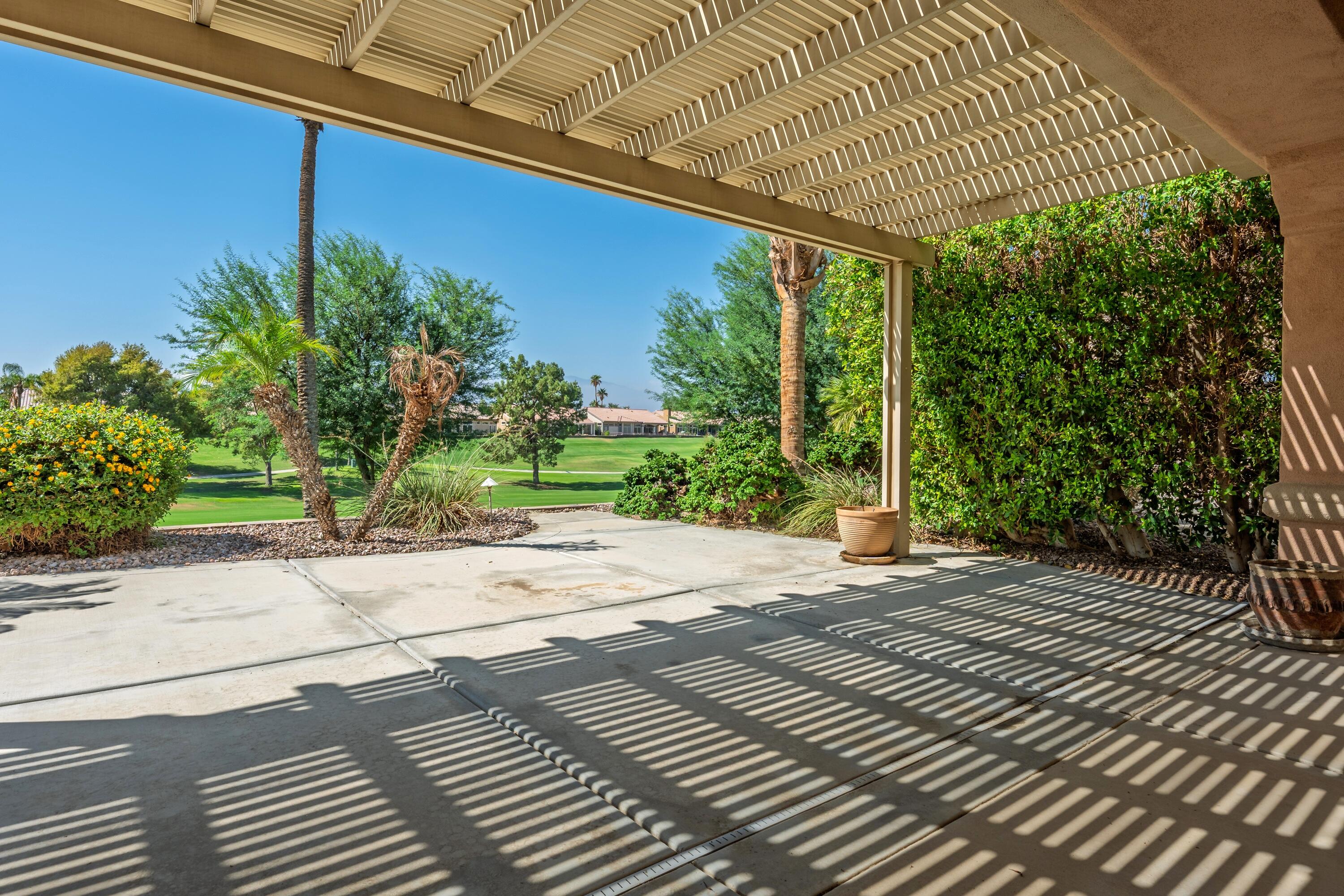 78513 Sunrise Mountain View Palm Desert, CA 92211 - Photo 45 of 45 a sidewalk with a trees in front of it