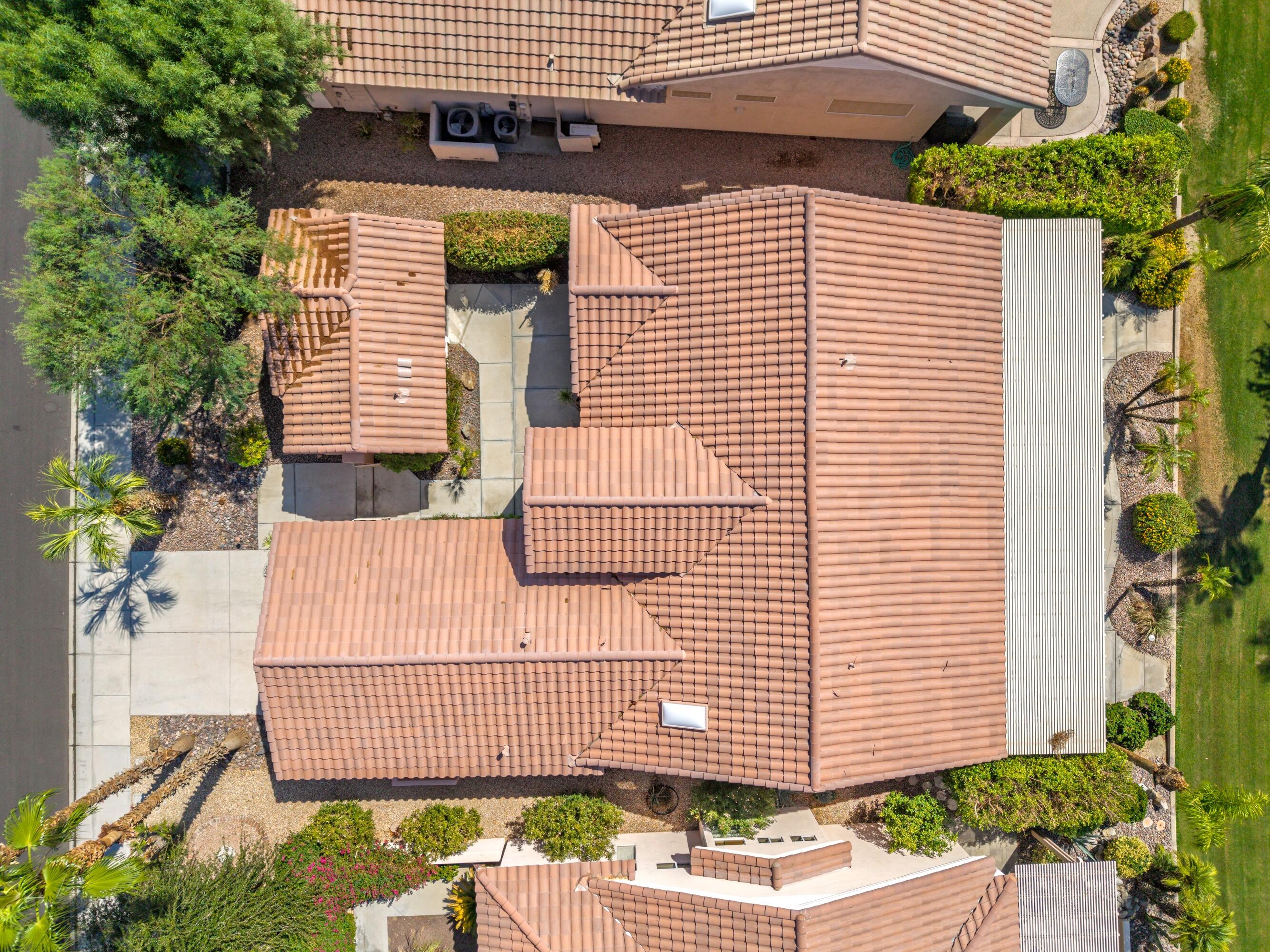 78513 Sunrise Mountain View Palm Desert, CA 92211 - Photo 7 of 45 a front view of a house with a garden