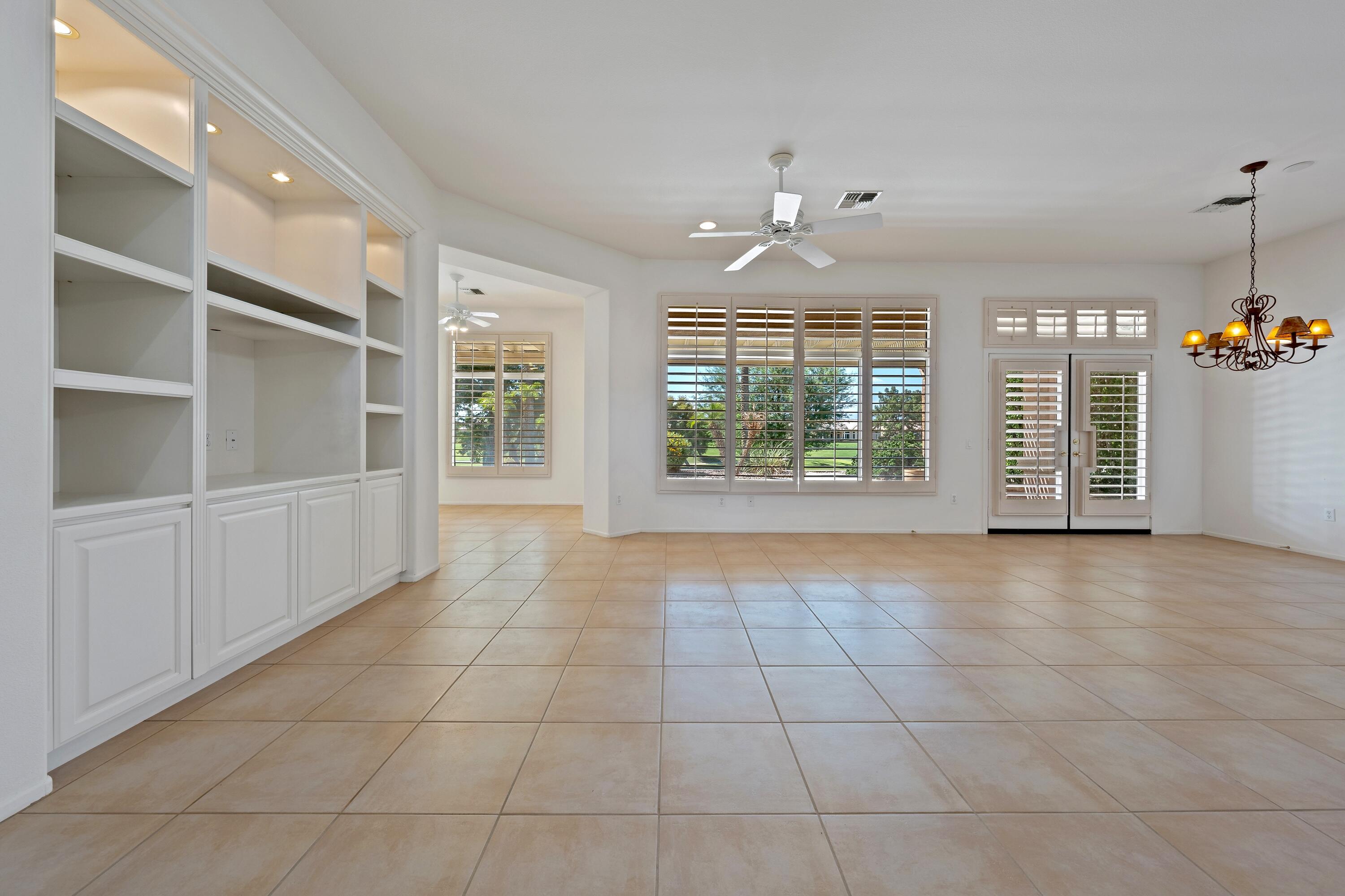 78513 Sunrise Mountain View Palm Desert, CA 92211 - Photo 10 of 45 a view of an empty room with a window