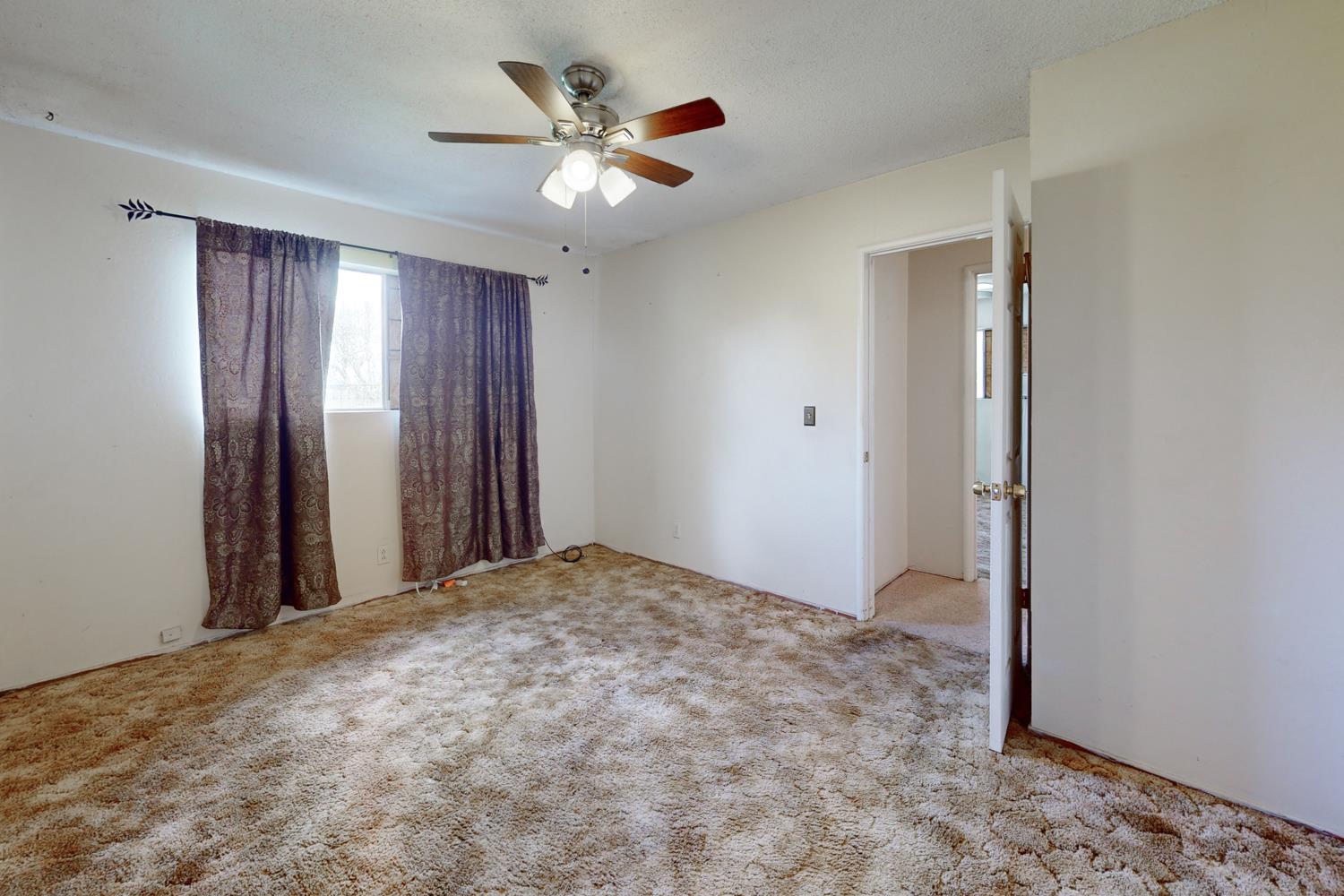 2065 Howlett Avenue Yuba City, CA 95993 - Photo 15 of 52 wooden floor in an empty room with a window
