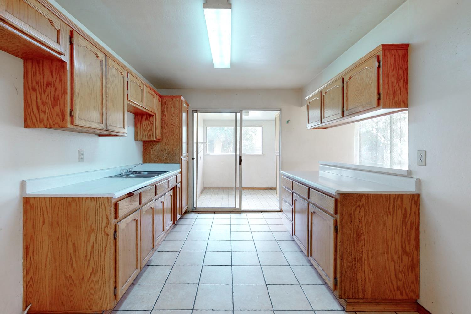 2065 Howlett Avenue Yuba City, CA 95993 - Photo 29 of 52 a kitchen with stainless steel appliances granite countertop a sink and a stove