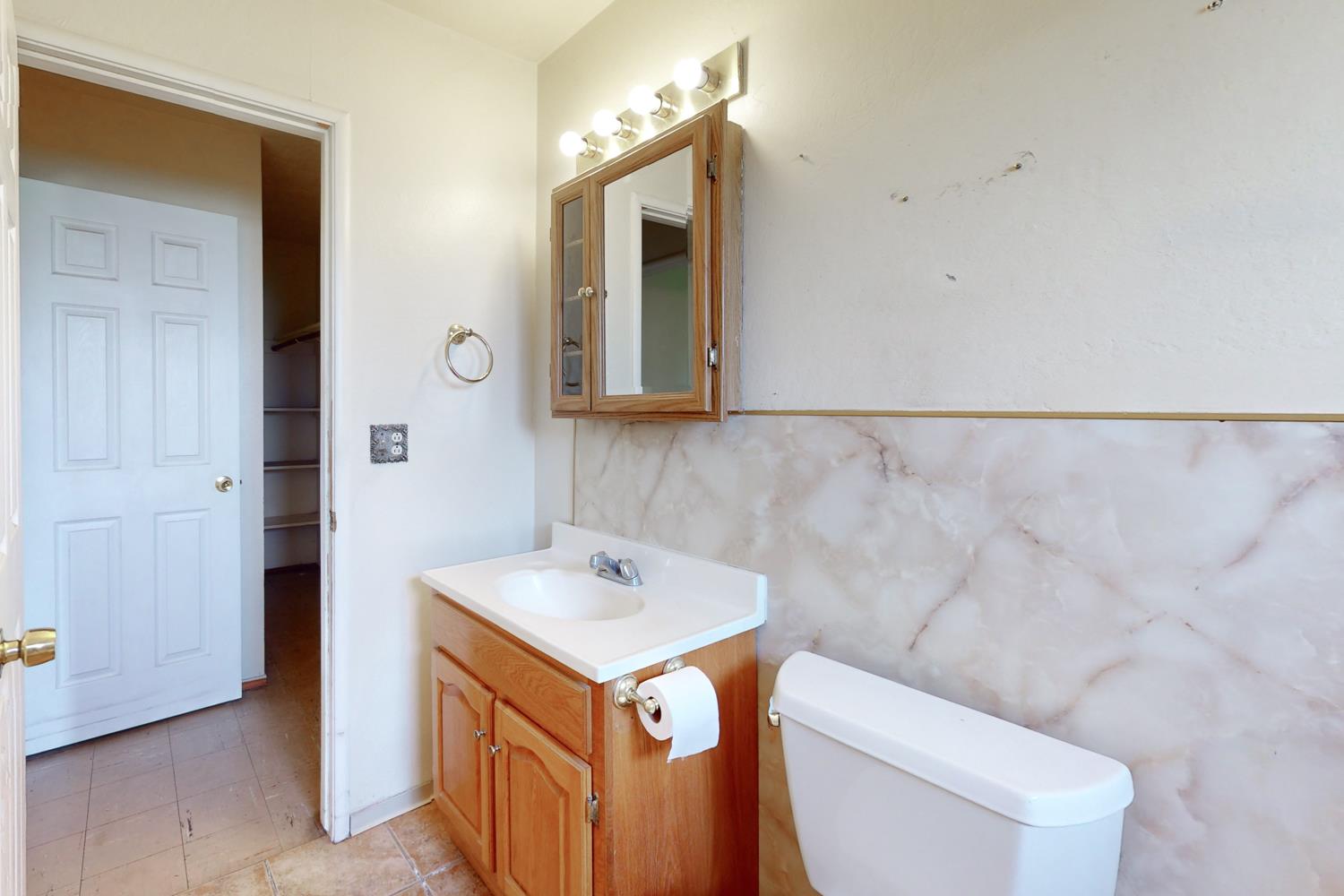 2065 Howlett Avenue Yuba City, CA 95993 - Photo 39 of 52 a bathroom with a sink vanity and toilet