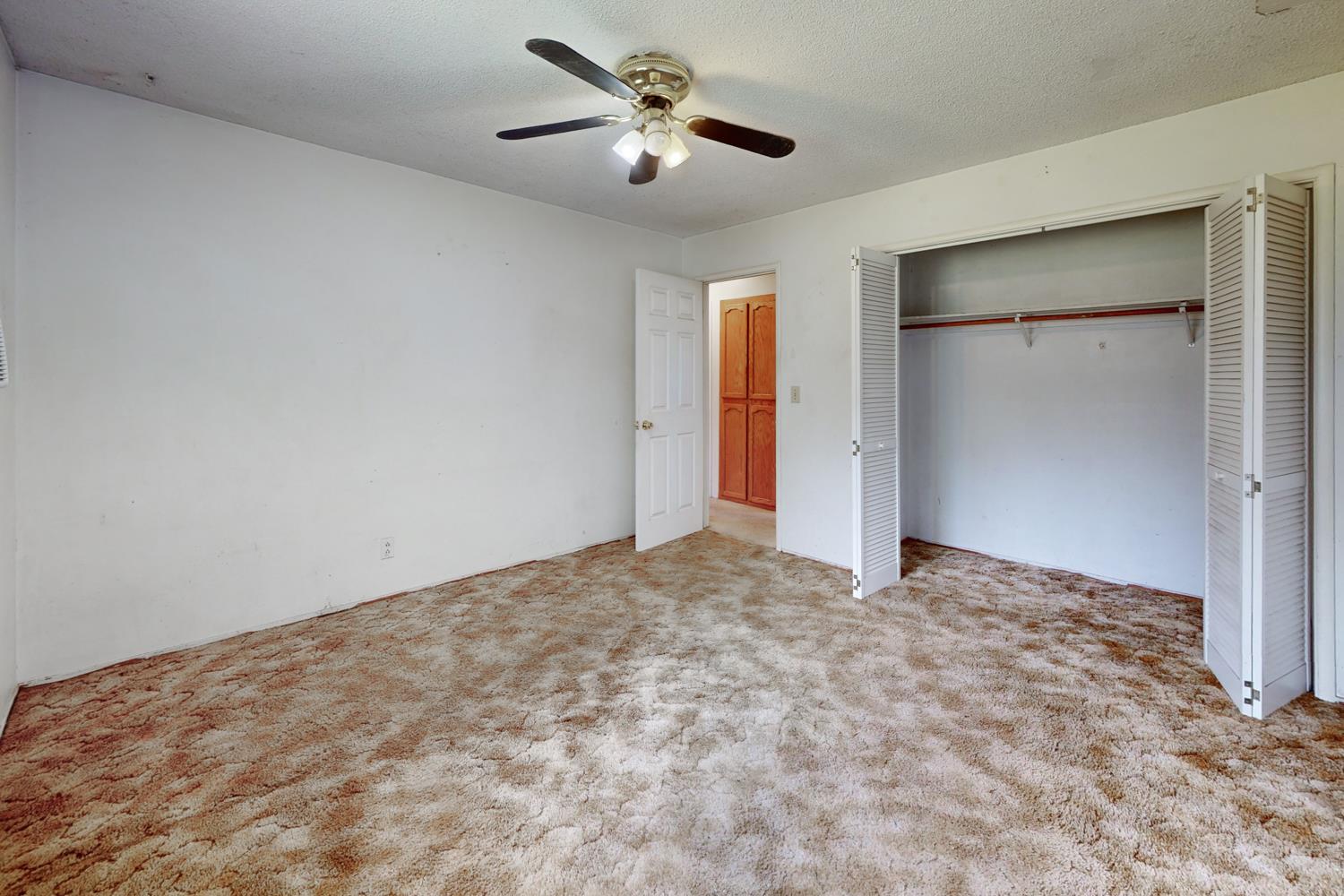 2065 Howlett Avenue Yuba City, CA 95993 - Photo 4 of 52 a view of a room with a ceiling fan and closet