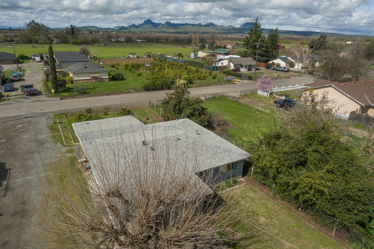 2065 Howlett Avenue Yuba City, CA 95993 - Photo 47 of 52 an aerial view of a house with a yard and lake view