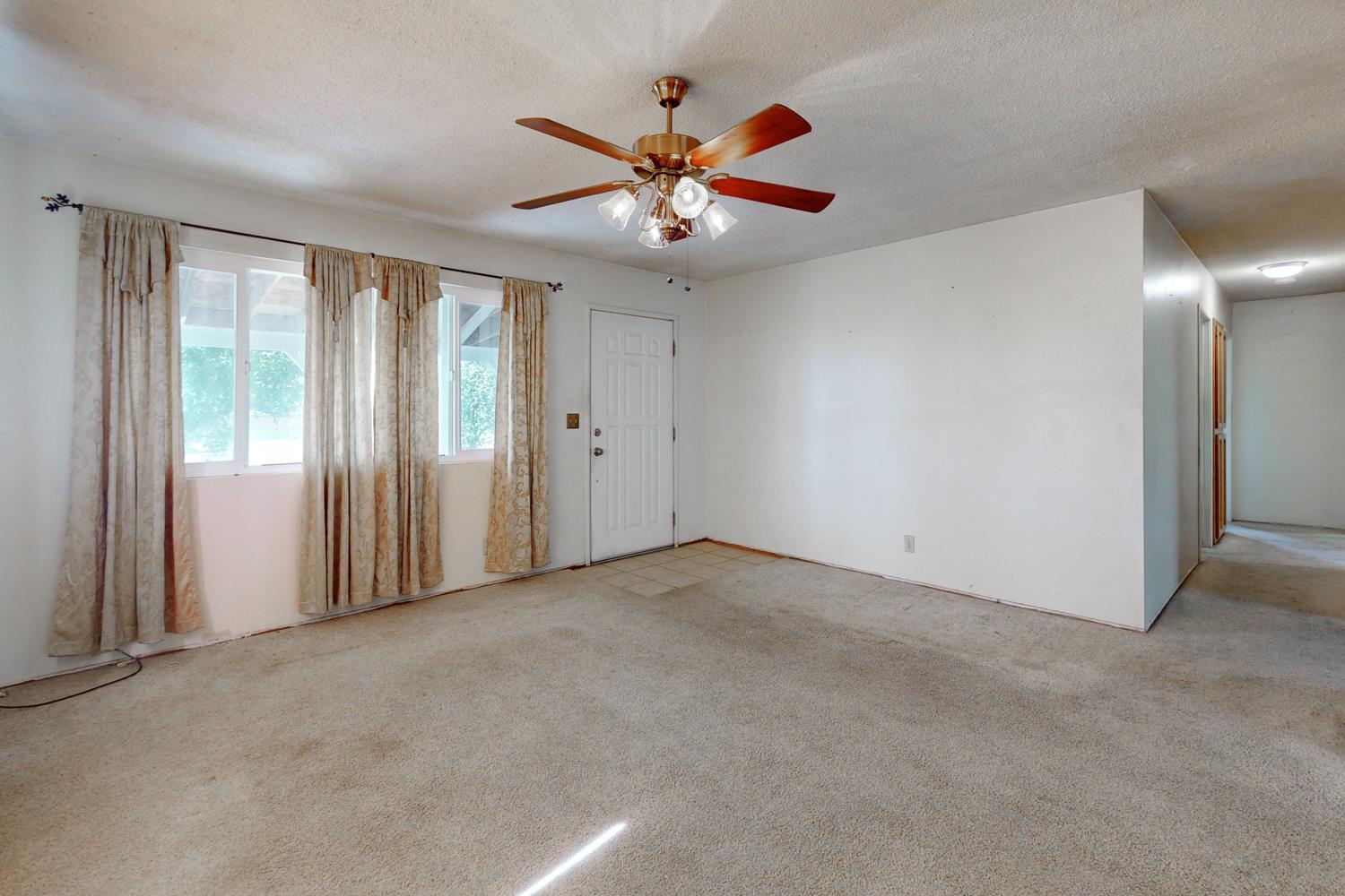 2065 Howlett Avenue Yuba City, CA 95993 - Photo 50 of 52 an empty room with ceiling fan and windows